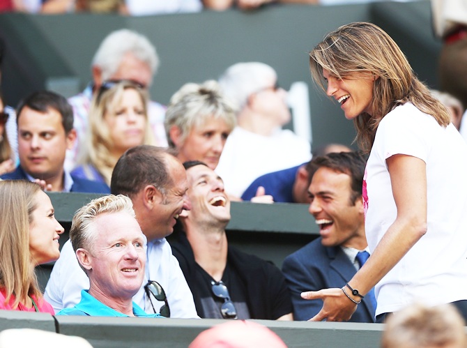 Andy Murray of Great Britain's girlfriend Kim Sears shakes a joke with his coach Amelie Mauresmo