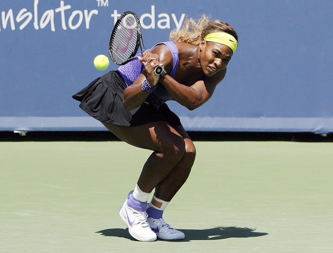 Serena Williams returns the shot of Jelena Jankovic on Friday
