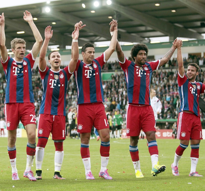 Bayern Munich's players celebrate their victory over   Preussen Muenster after their German soccer cup (DFB Pokal) first round soccer match