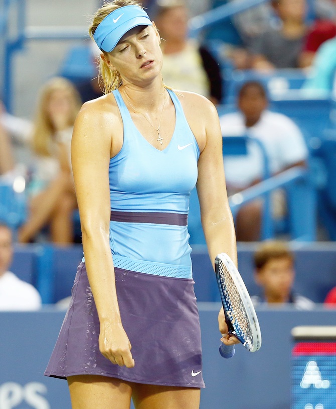 Maria Sharapova of Russia is dejected in her match against Ana Ivanovic of Serbia