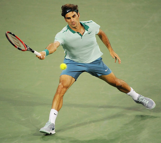 Roger Federer of Switzerland returns