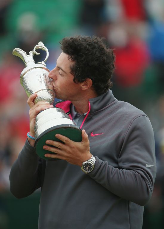 Rory McIlroy of Northern Ireland kisses the Claret Jug