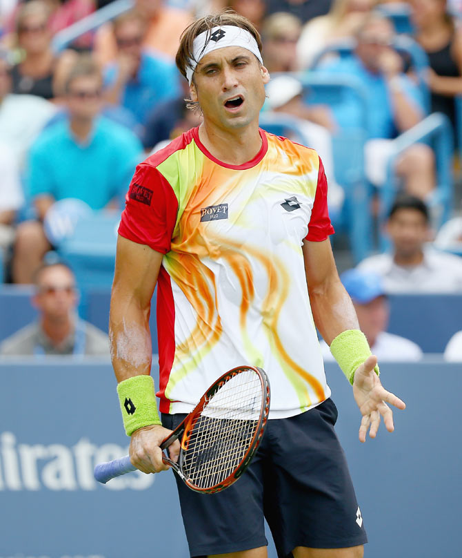 David Ferrer of Spain reacts to losing a point in the loss to Roger Federer of Switzerland on Sunday