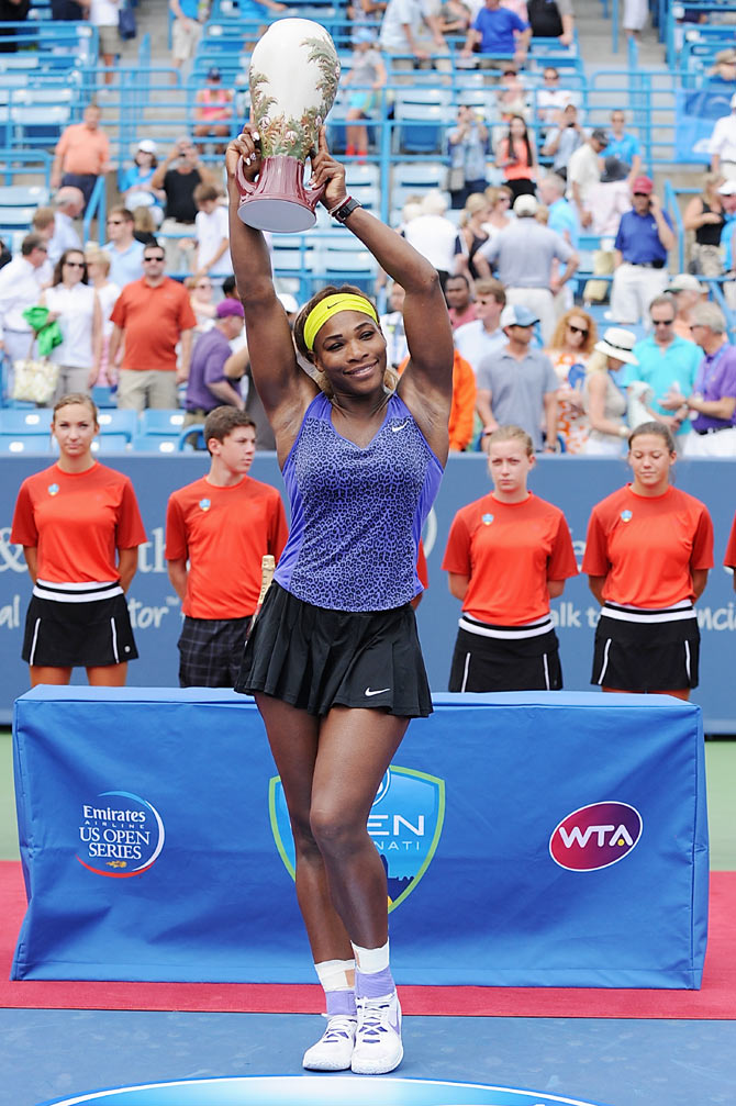 Serena Williams poses with the winner's trophy after Cincinnati final on Sunday