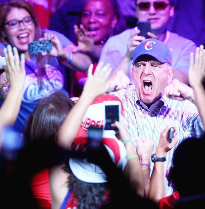 New owner of the Los Angeles Clippers Steve Ballmer reacts to the fans after being   introduced for the first time during Los Angeles Clippers Fan Festival at Staples Center