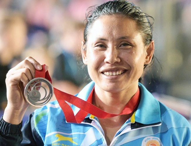 Sarita Devi with her 2014 Commonwealth medal. Photograph: PTI