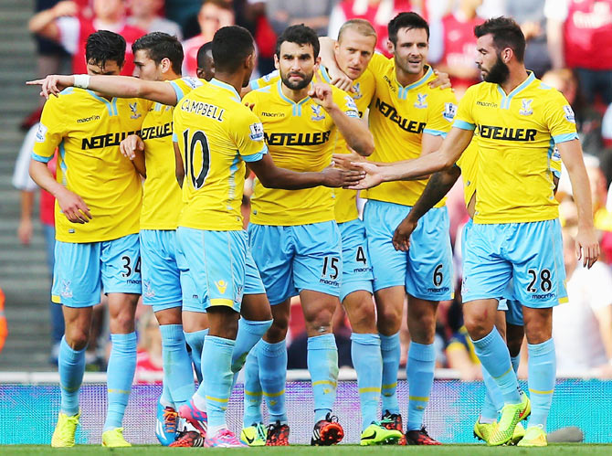 Crystal Palace players celebrate a goal by teammate Brede Hangeland (3rd from right)