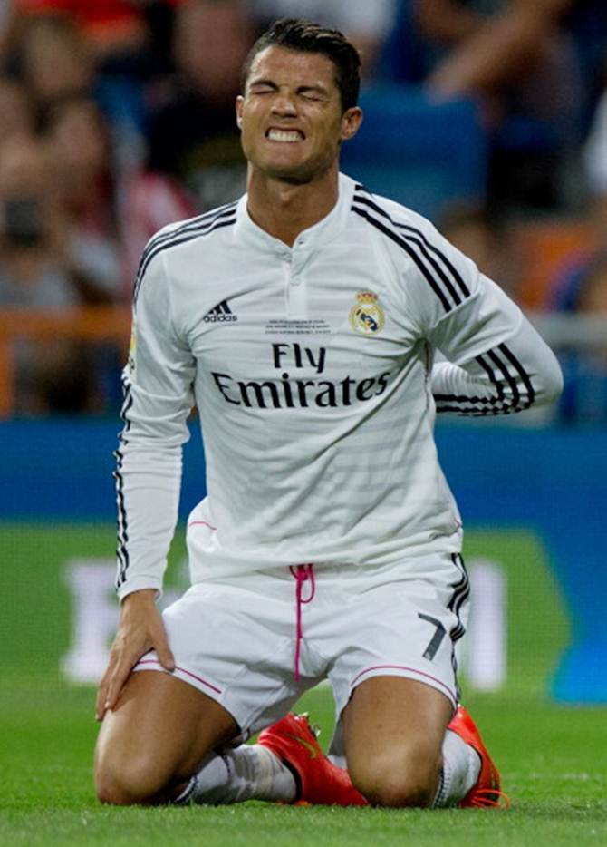 Real Madrid's Cristiano Ronaldo grimaces in pain during the Supercopa first leg match against Atletico de Madrid