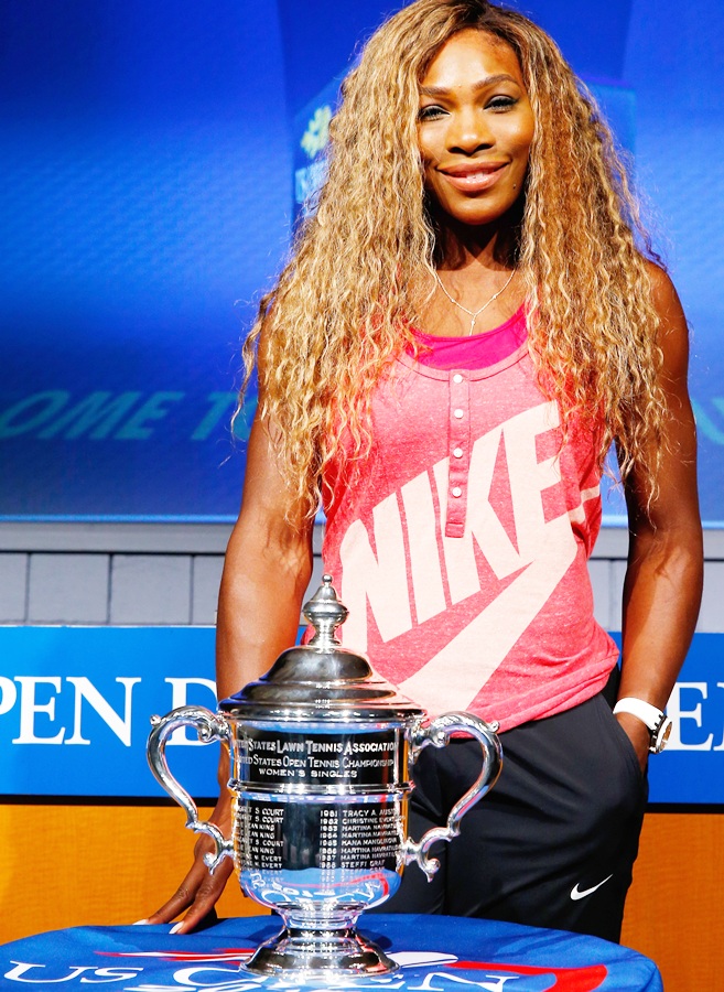 Serena Williams of the United States smiles alongside the Women's Singles US Open trophy