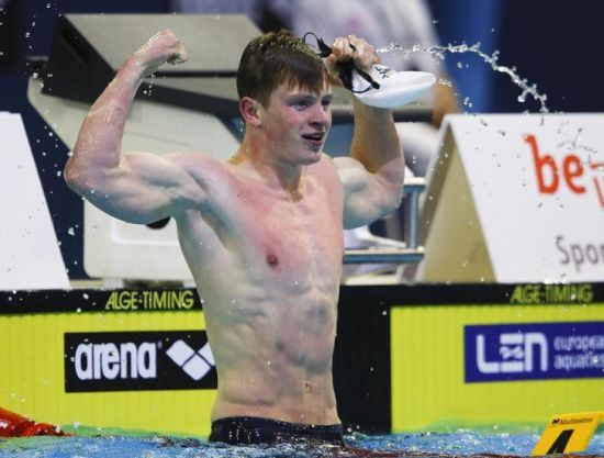 Adam Peaty of Britain celebrates after the men's 50m breaststroke semi-final at the European Swimming Championships in Berlin