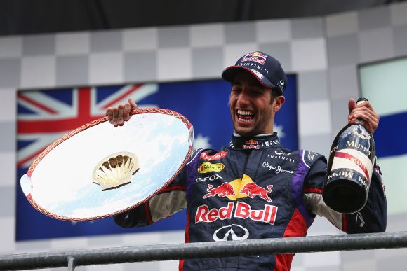 Daniel Ricciardo of Australia and Infiniti Red Bull Racing celebrates on the podium after winning the Belgian Grand Prix 