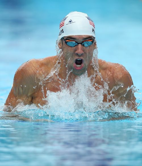 Michael Phelps of the USA swims the Men's 200m IM heats 