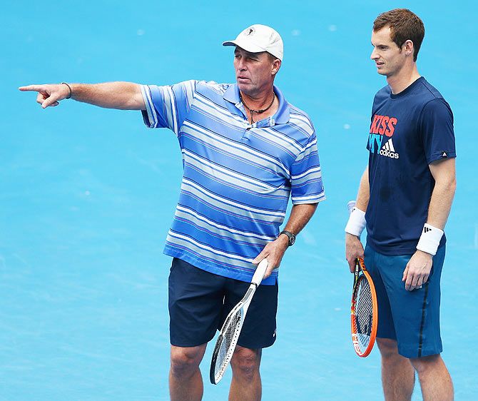 Andy Murray of Great Britain talks to his coach Ivan Lendl during a practice session