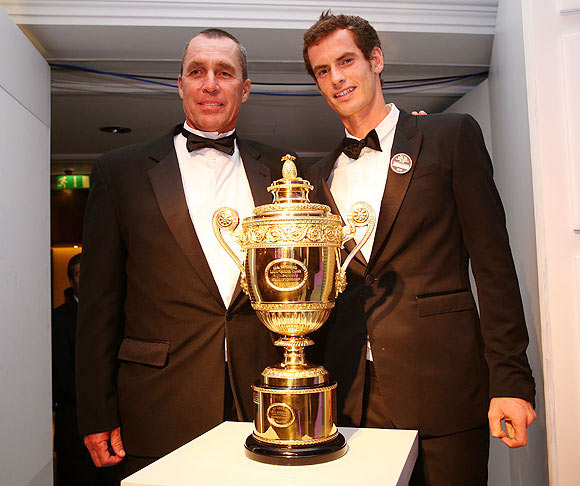 2013 Wimbledon champion Andy Murray poses with coach Ivan Lendl (left) during the Wimbledon Championships 2013 Winners Ball at InterContinental Park Lane Hotel