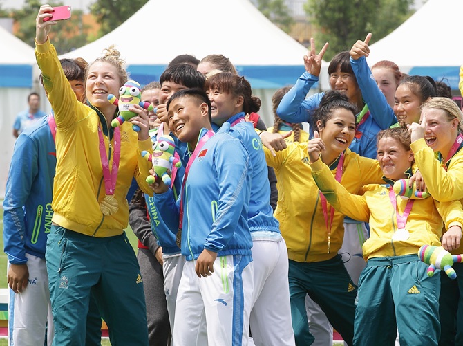 Members of Australia, Canada and China women's rugby team pose for a selfie after the  Rugby Sevens final on Day four of the Nanjing 2014 Summer Youth Olympic Games
