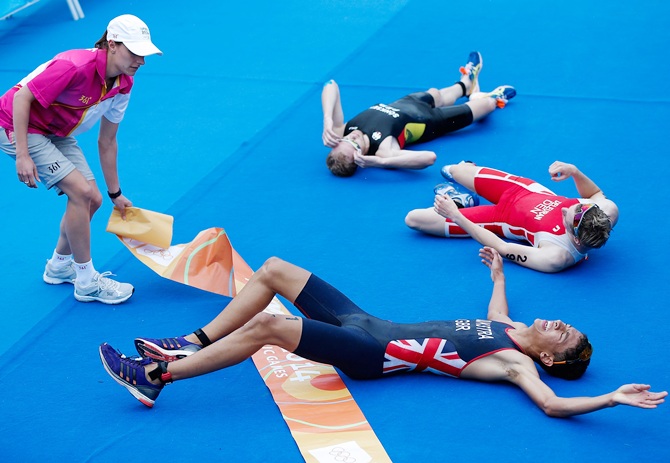 Ben Dijkstra of Great Britain, front, celebrates with the other athletes after crossing the finish line in the Men's Triathlon on Day two of Nanjing 2014 Summer Youth Olympic Games