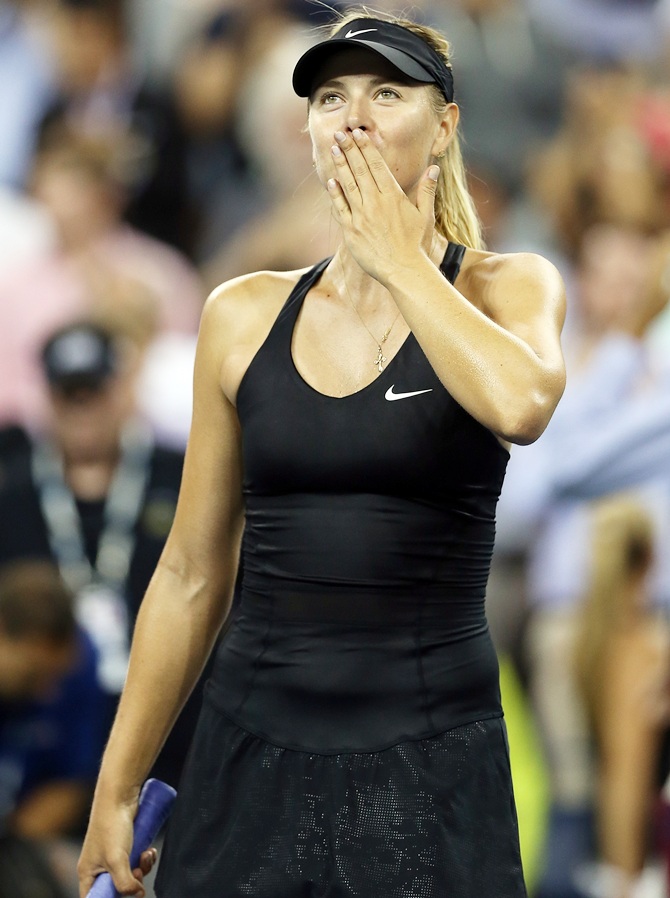 Maria Sharapova of Russia reacts after defeating Maria Kirilenko of Russia