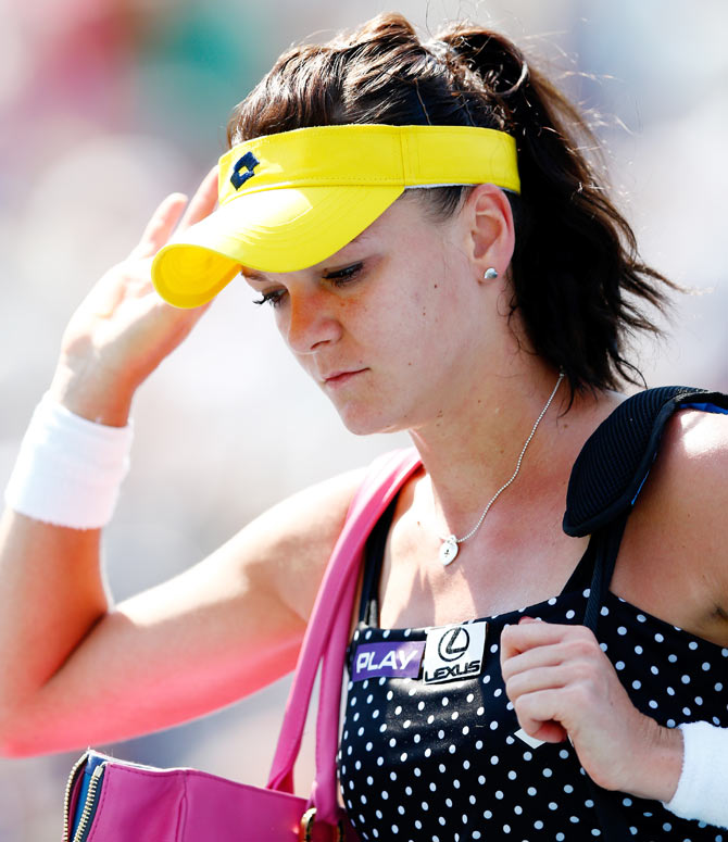 Agnieszka Radwanska of Poland reacts aftrer being defeated by Shuai Peng of China on Wednesday