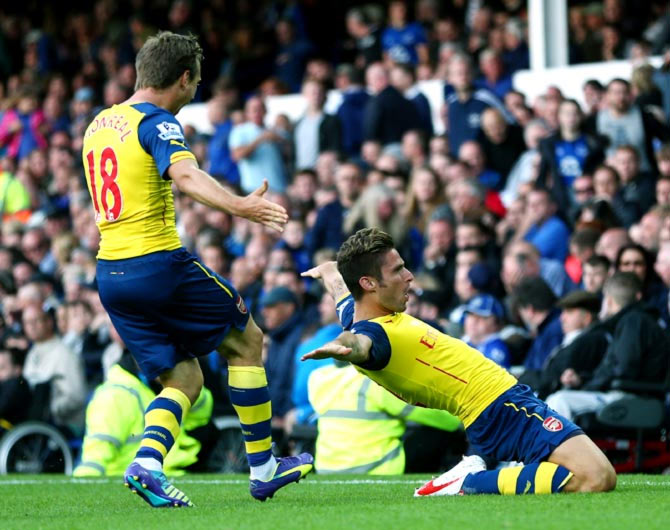 Olivier Giroud (right) celebrates scoring Arsenal's second goal