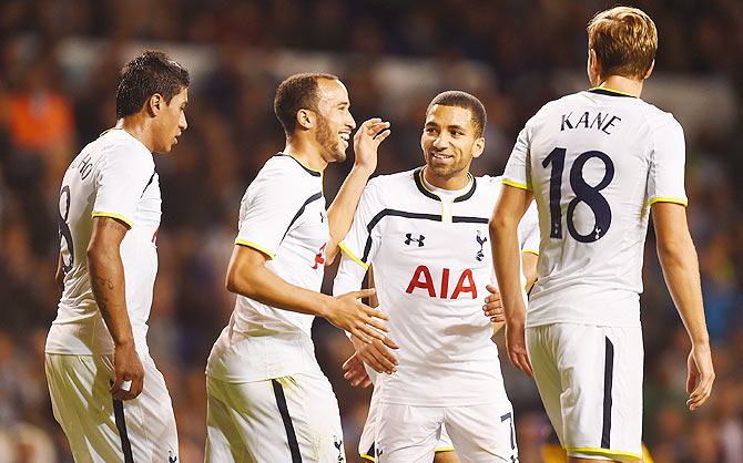 Andros Townsend of Spurs celebrates scoring theiur third goal from the penalty spot with Aaron Lennon, Paulinho and Harry Kane of Spurs