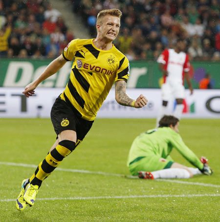 Borussia Dortmund's Marco Reus celebrates a goal against Augsburg during the German Bundesliga first division soccer match in Augsburg on Friday