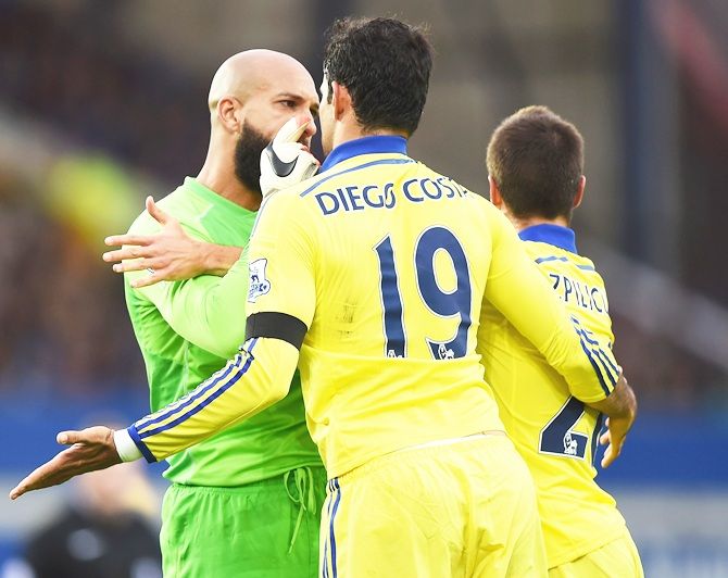 Tim Howard of Everton confronts Diego Costa of Chelsea