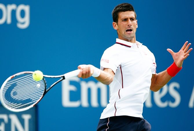 Novak Djokovic of Serbia returns a shot