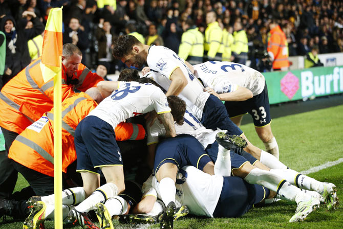 Tottenham Hotspur's Christian Eriksen (UNSEEN) celebrates scoring a goal with team-mates during their English Premier League soccer match against Hull City