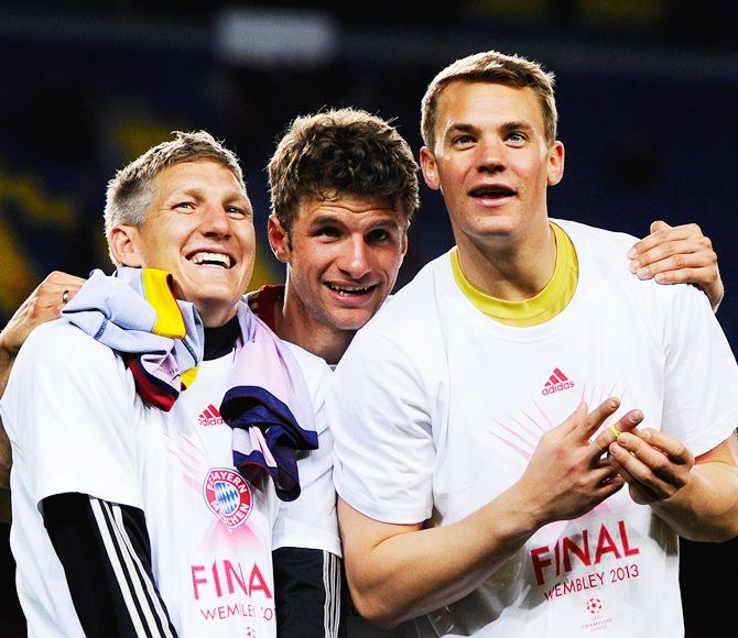 From left, Bastian Schweinsteiger, Thomas Muller and Manuel Neuer of Munich
