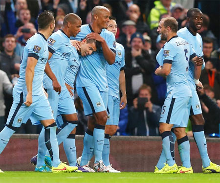 Sergio Aguero of Manchester City celebrates with teammates