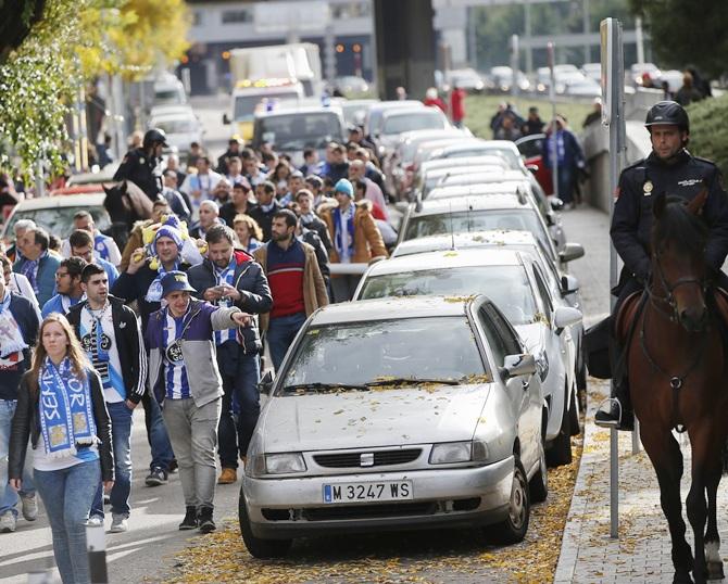 Spanish police escort Deportivo Coruna fans