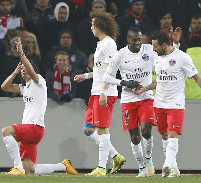 Edinson Cavani, left, of Paris St Germain celebrates 