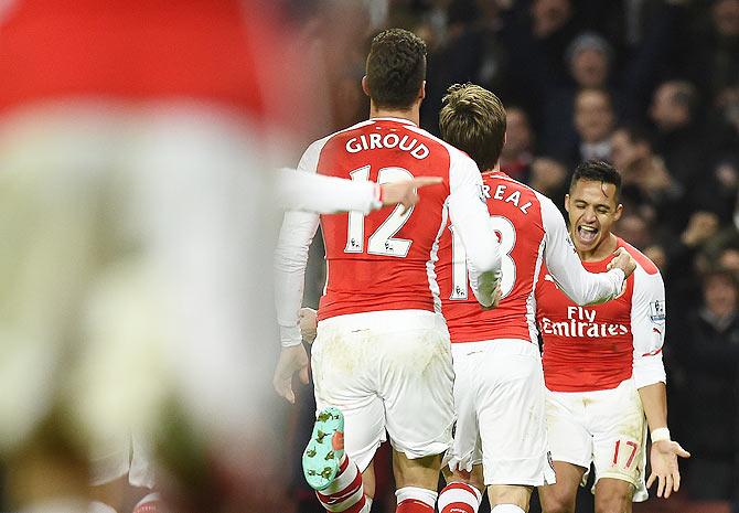 Arsenal's Alexis Sanchez (right) celebrates his goal against Southampton at the Emirates Stadium on Wednesday