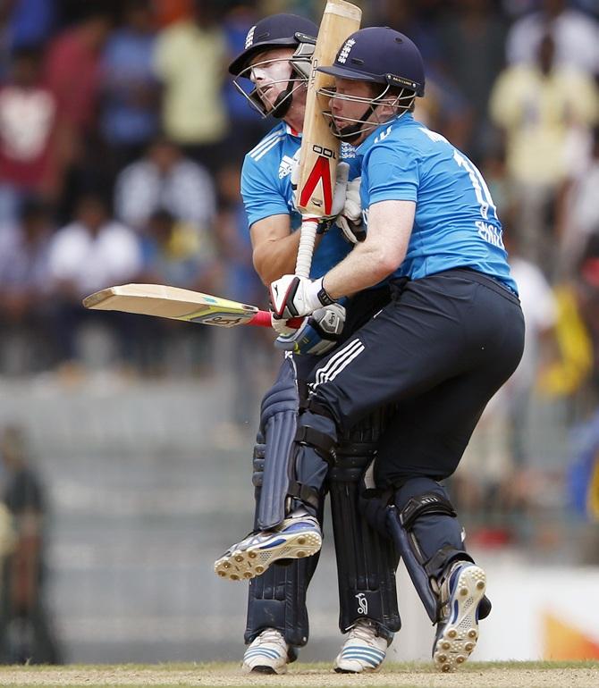 England's captain Eoin Morgan, right, and his team mate Jos Buttler