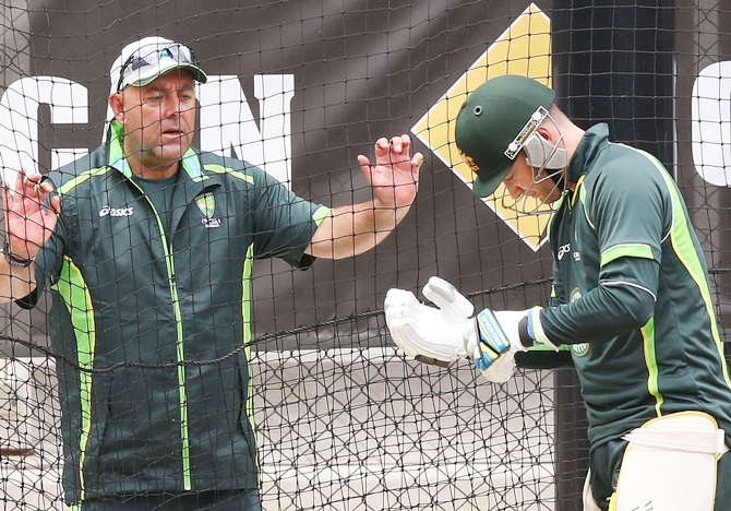 Head coach Darren Lehmann speaks to Michael Clarke during Australian nets session