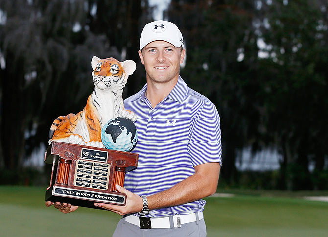 Jordan Spieth with the winner's trophy after his ten-stroke victory at the Hero World Challenge at the Isleworth Golf & Country Club in Windermere, Florida, on Sunday