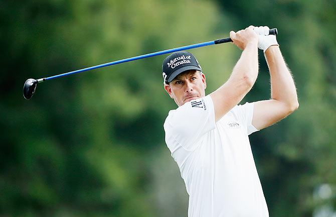 Henrik Stenson of Sweden hits his tee shot on the 12th hole during the final round of the Hero World Challenge