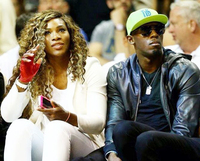 Serena Williams and Usain Bolt watch the Miami Heat and San Antonio Spurs
