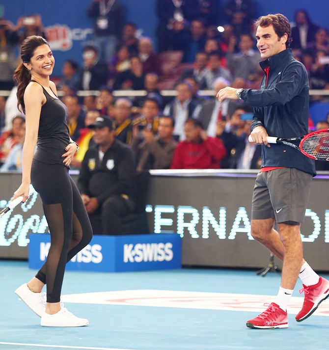 Actress Deepika Padukone plays tennis with Roger Federer of the Indian Aces