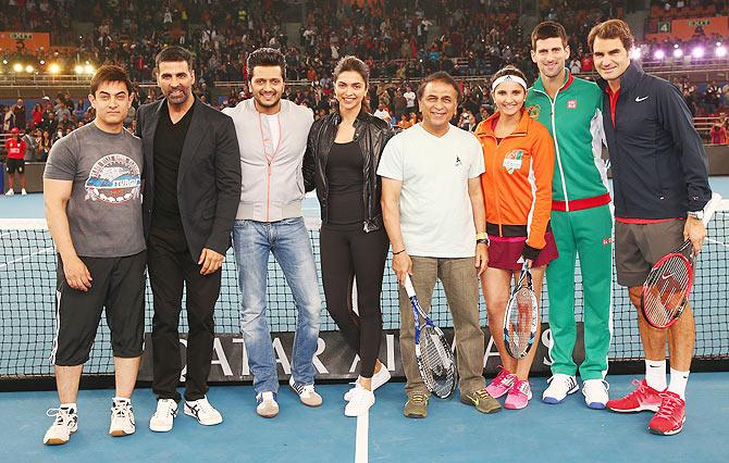 Bollywood stars Aamir Khan, Akshay Kumar, Reitesh Deshmukh, Deepika Padukone with cricket legend Sunil Gavaskar and tennis stars Sania Mirza, Novak Djokovic and Roger Federer at a pro-am match during the International Premier Tennis League third leg at the Indira Gandhi Indoor Stadium on Monday