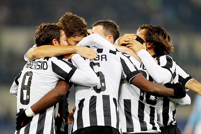 Players of Juventus celebrate after scoring