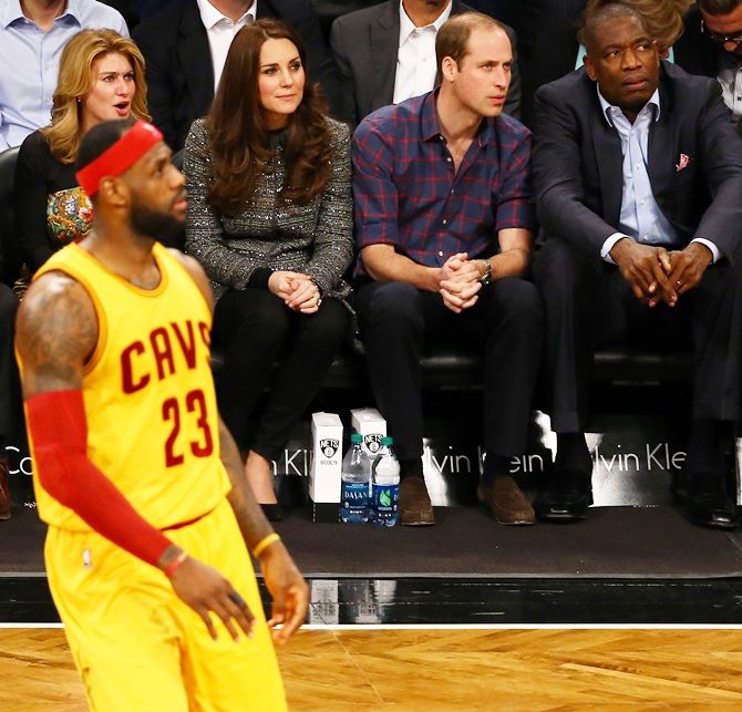 Prince William, Duke of Cambridge and Catherine, Duchess of Cambridge watch the game between   the Cleveland Cavaliers and the Brooklyn Nets