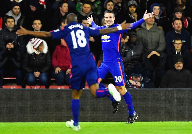 Robin van Persie of Manchester United celebrates scoring the opening goal against Southampton during their English Premier League match at St Mary's Stadium in Southampton on Monday