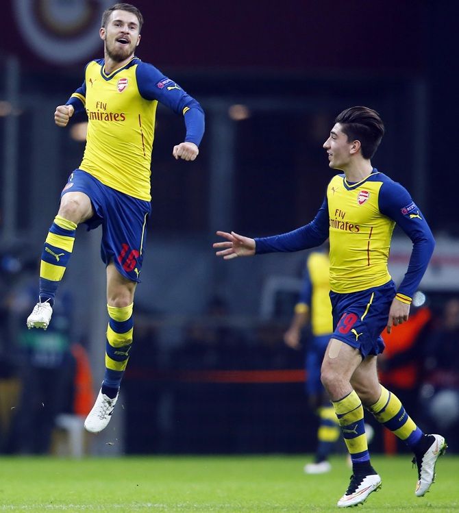 Arsenal's Aaron Ramsey, left, celebrates