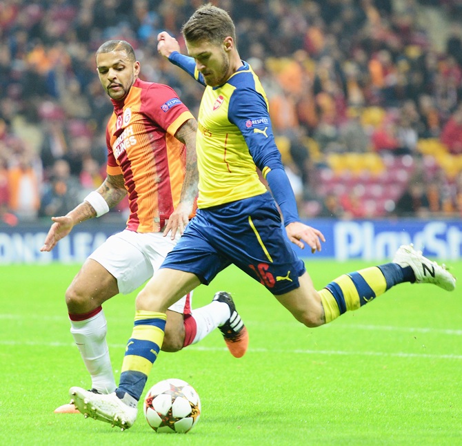 Aaron Ramsey of Arsenal, right, scores