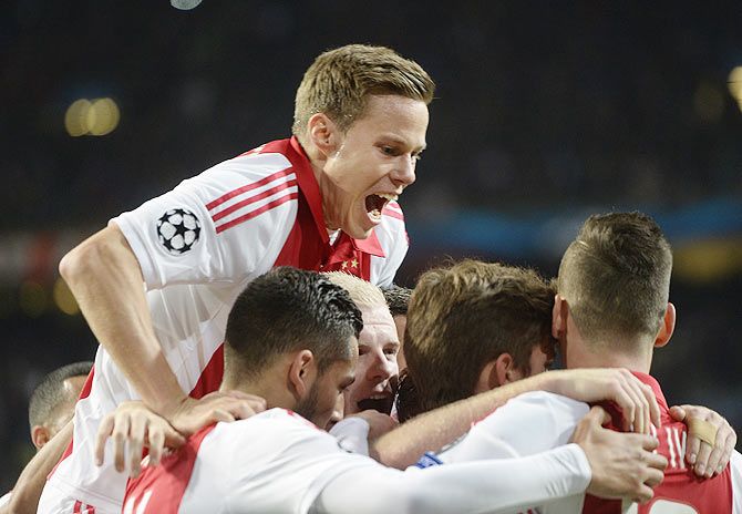 jax Amsterdam's Niklas Moisander and teammates celebrate a goal against APOEL Nicosia 