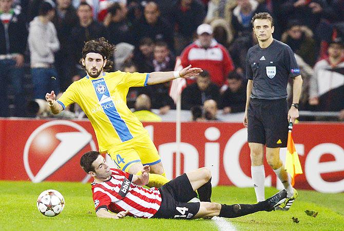 Athletic Bilbao's Markel Susaeta (bottom) fights for the ball with BATE Borisov's Anri Khagush 