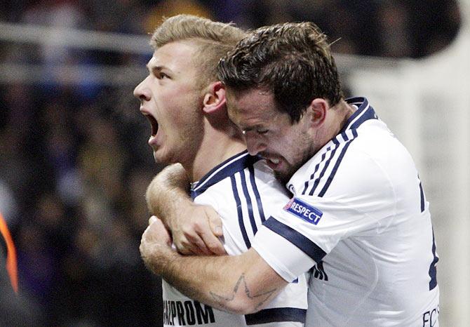 Schalke 04's Max Meyer celebrates with teammate Christian Fuchs after scoring against Maribor