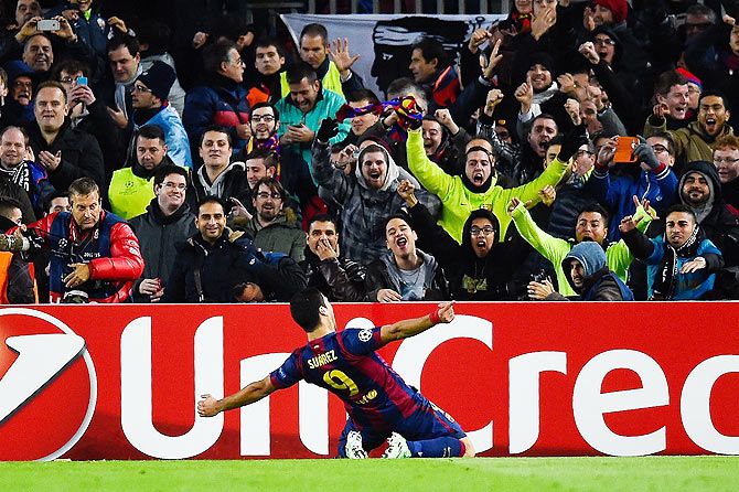 Luis Suarez of FC Barcelona celebrates after scoring his team's third goal