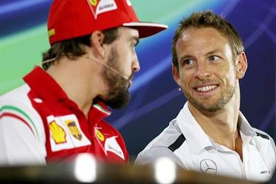 Fernando Alonso of Spain and Ferrari and Jenson Button of Great Britain and McLaren during the drivers' press conference ahead of the Abu Dhabi Formula One Grand Prix at Yas Marina Circuit on November 20, 2014.